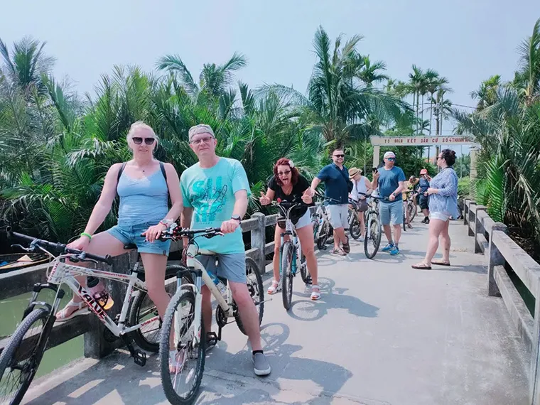 There's nothing more wonderful than cycling among the rows of green water coconut trees in the Cam Thanh coconut forest