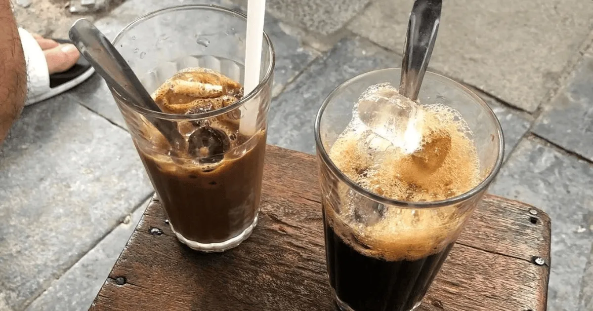 A historic spot serving velvety, hand-whisked coffee in traditional ceramic cups - Photo Source: Cafe Nhĩ
