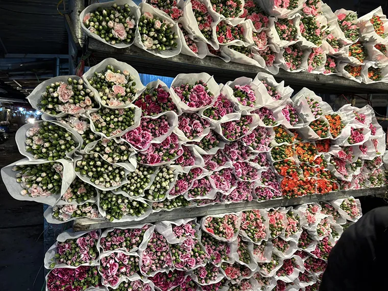 Countless types of flowers are displayed for sale at the market