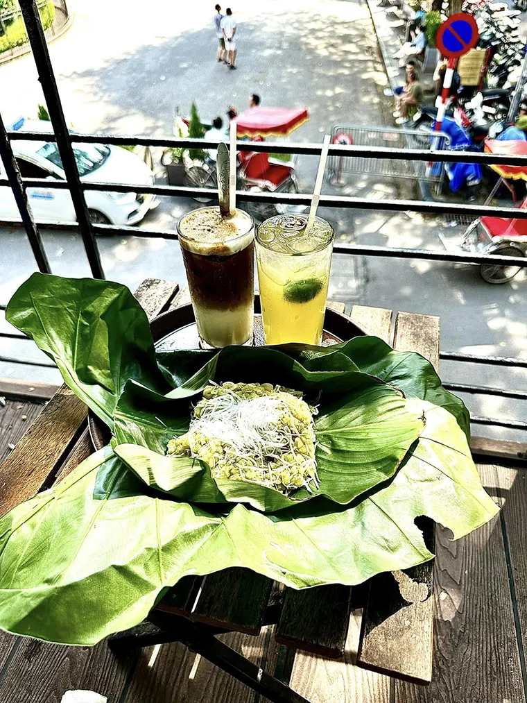 Enjoying coffee and green sticky rice in front of St. Joseph's Cathedral