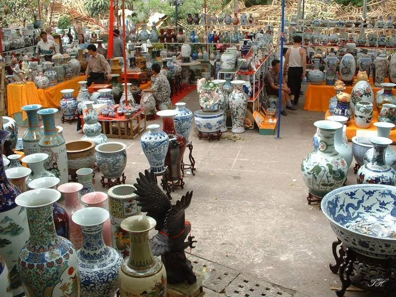 A display of beautifully crafted ceramic vases, bowls, or tourists trying pottery-making - Photo Source: Tourist Love Vietnam