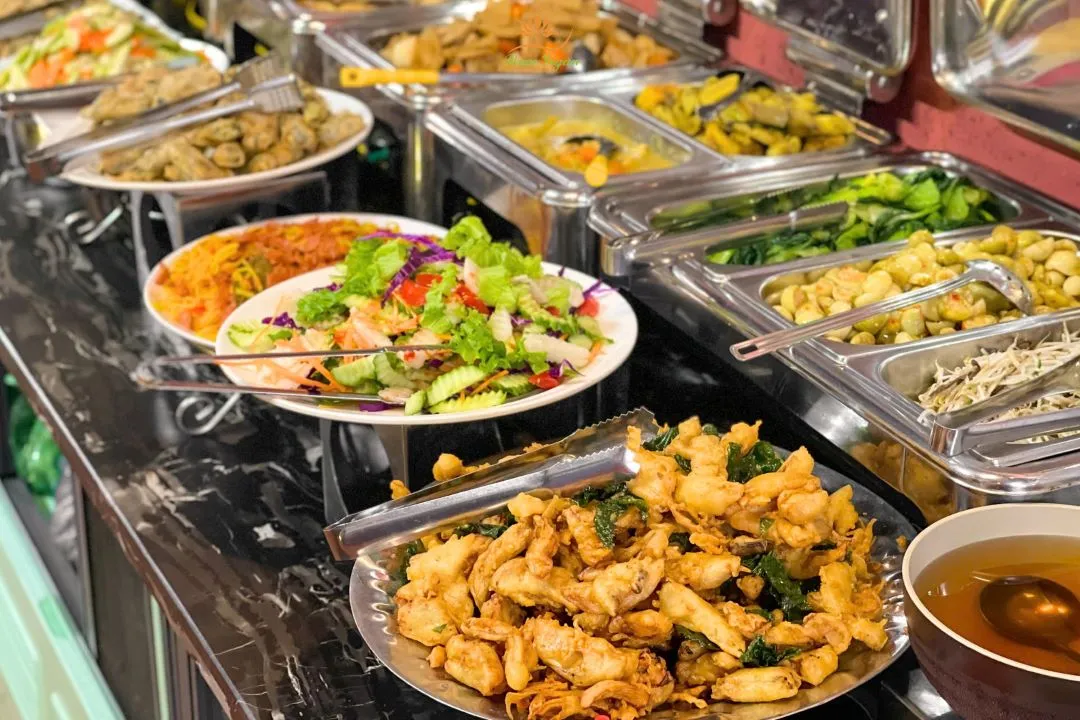 Buffet with chickpea patties, fried potatoes, and vegan bún riêu - Photo Source: Peace Vegan - Buffet Chay & Đồ Uống