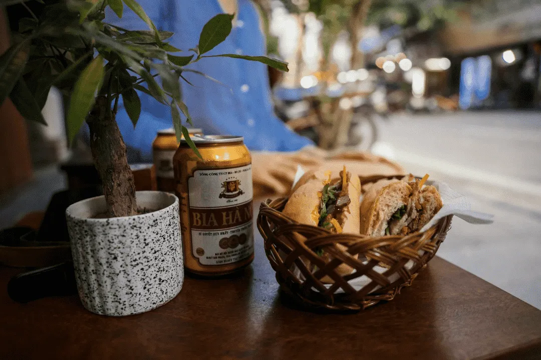Eating banh mi on the sidewalk while watching the city go by is a must-try in Hanoi. - Image source: Pexels