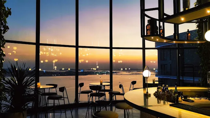 On The Rocks Rooftop Bar boasts a lively atmosphere, offering stunning panoramic views and a wide selection of refreshing drinks for a memorable night out. - Photo source: Google Maps