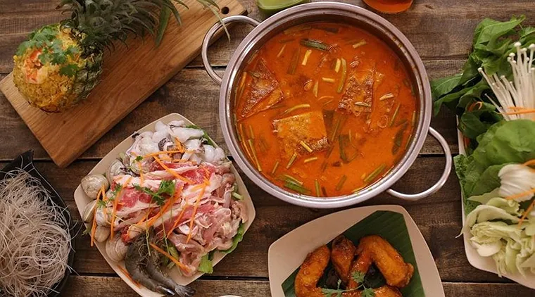 Koh Yam offers a diverse Thai culinary experience with a menu of nearly 100 dishes