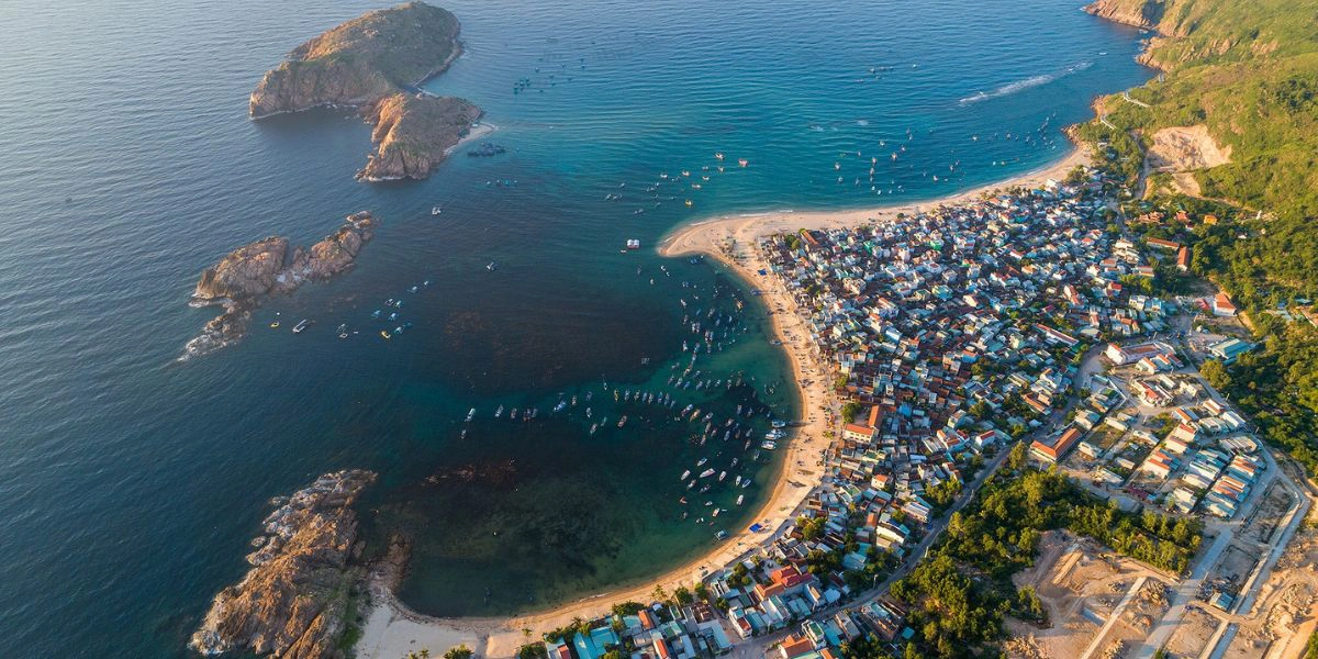 Where should you stay when traveling to Quy Nhon?
