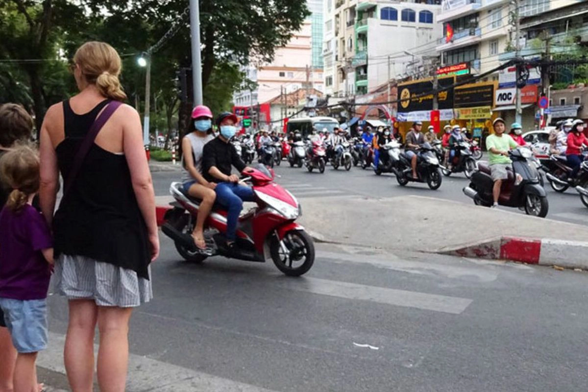 Crossing the busy streets is part of the Vietnam travel adventure