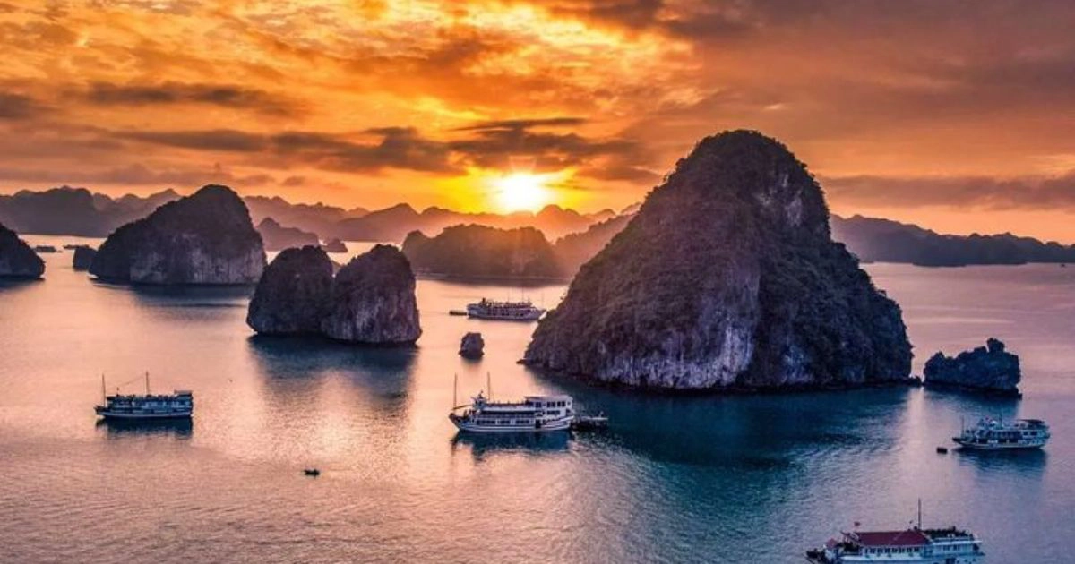 Halong Bay limestone islands sunset cruise view