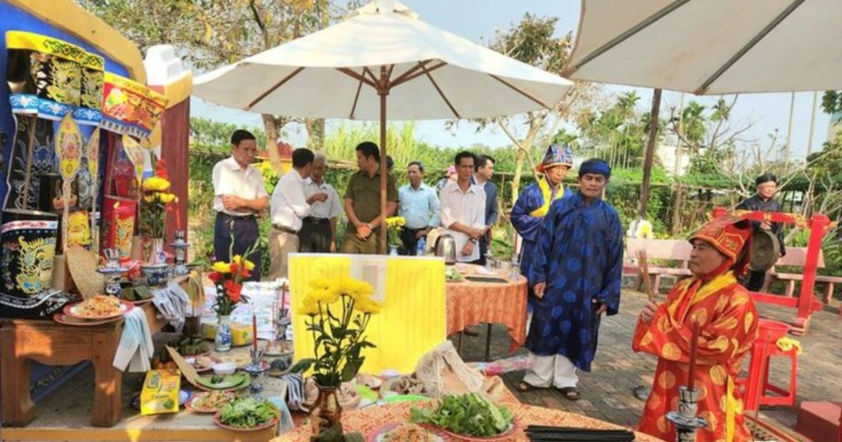 Visitors respecting local customs at a Vietnam temple