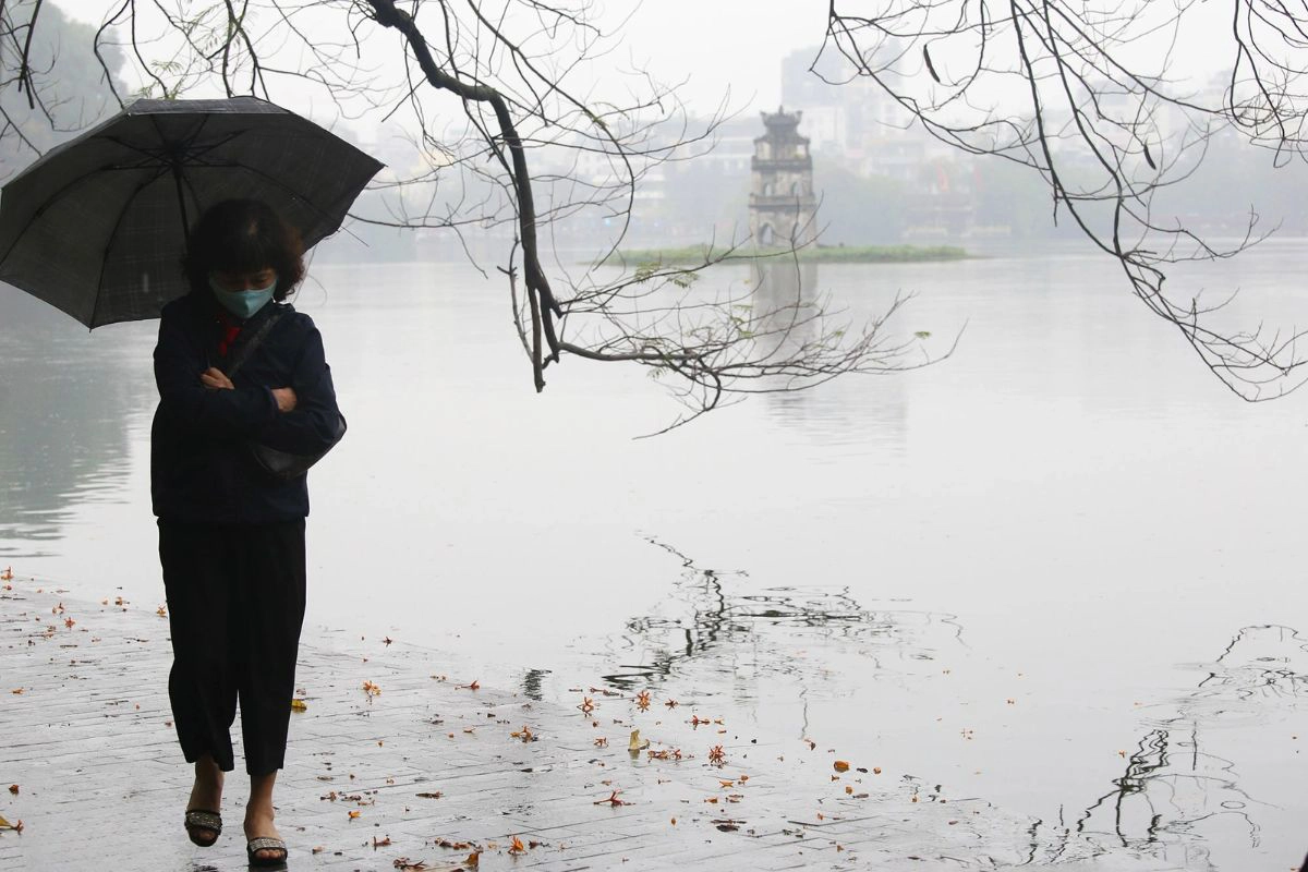 Morning fog over Hoan Kiem Lake creates a moody, photogenic winter atmosphere