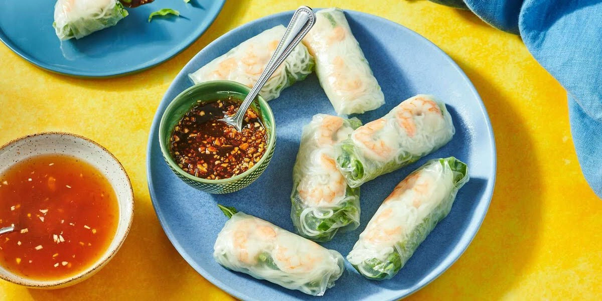 Fresh vegan rice paper rolls with light dipping sauce