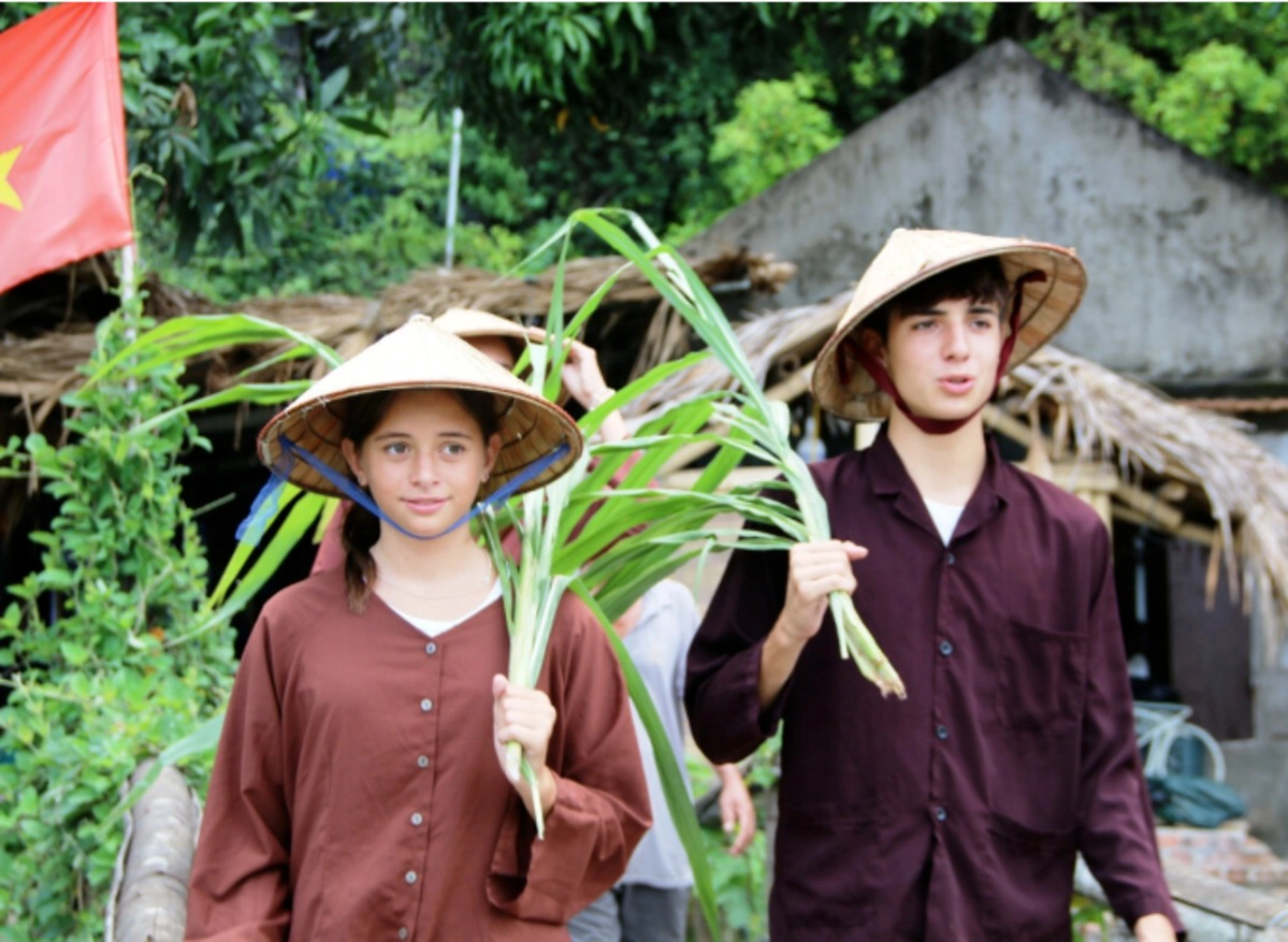 Tourists experience local village life on the way to Buffalo Cave, Ninh Binh