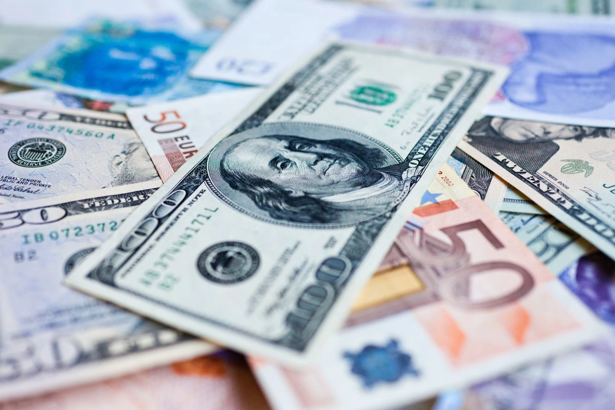 Crisp foreign banknotes ready for currency exchange locally
