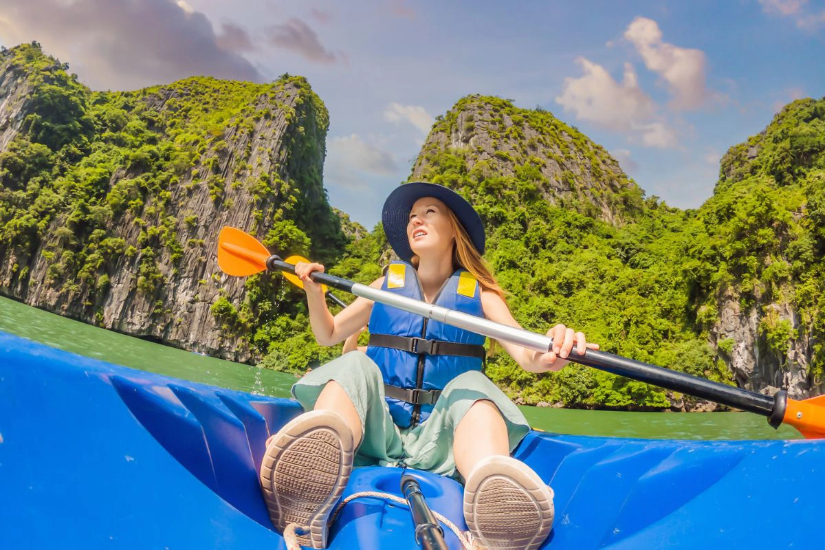 Kayaking through the quiet emerald waters of Bai Tu Long