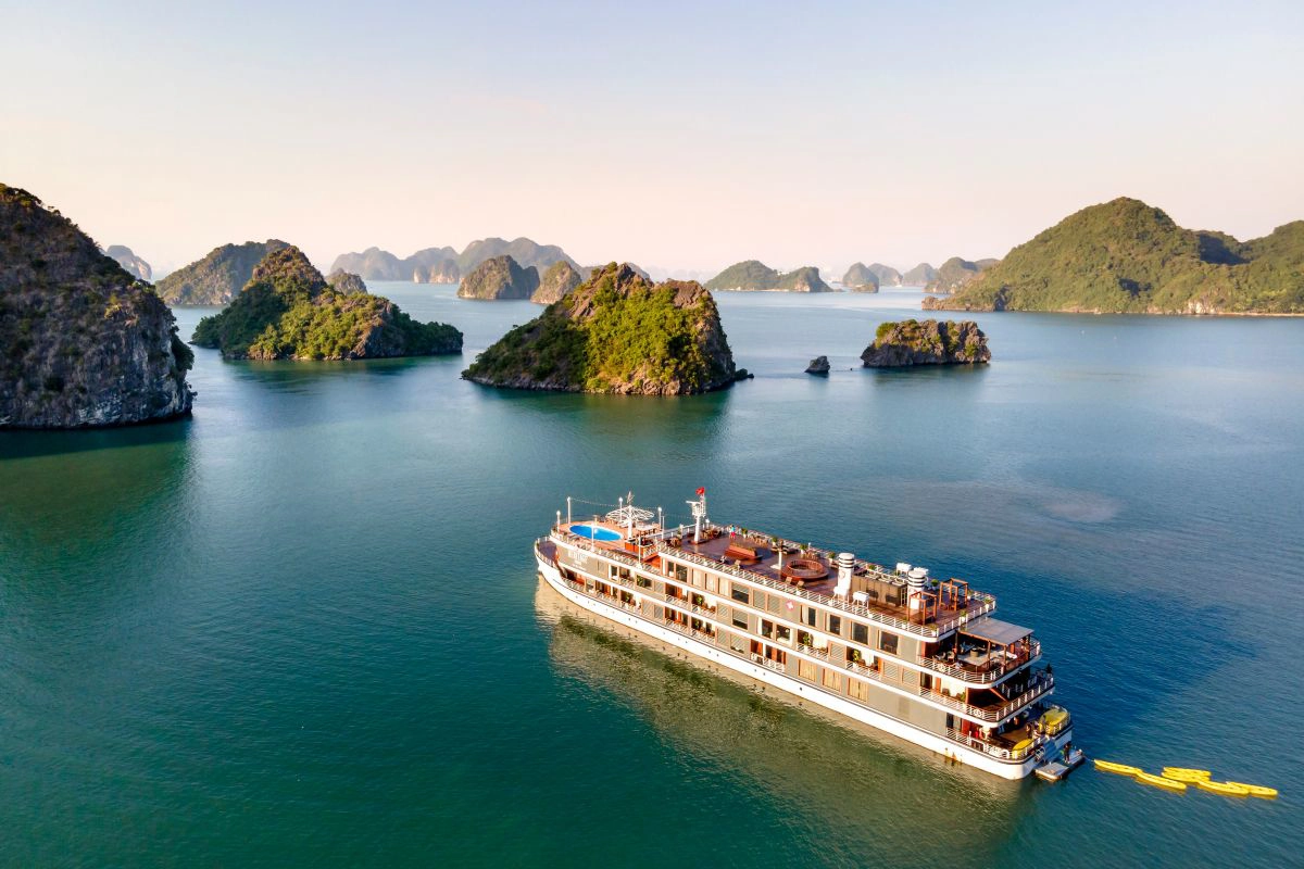 Luxury steel vessel anchoring near beautiful Lan Ha islands
